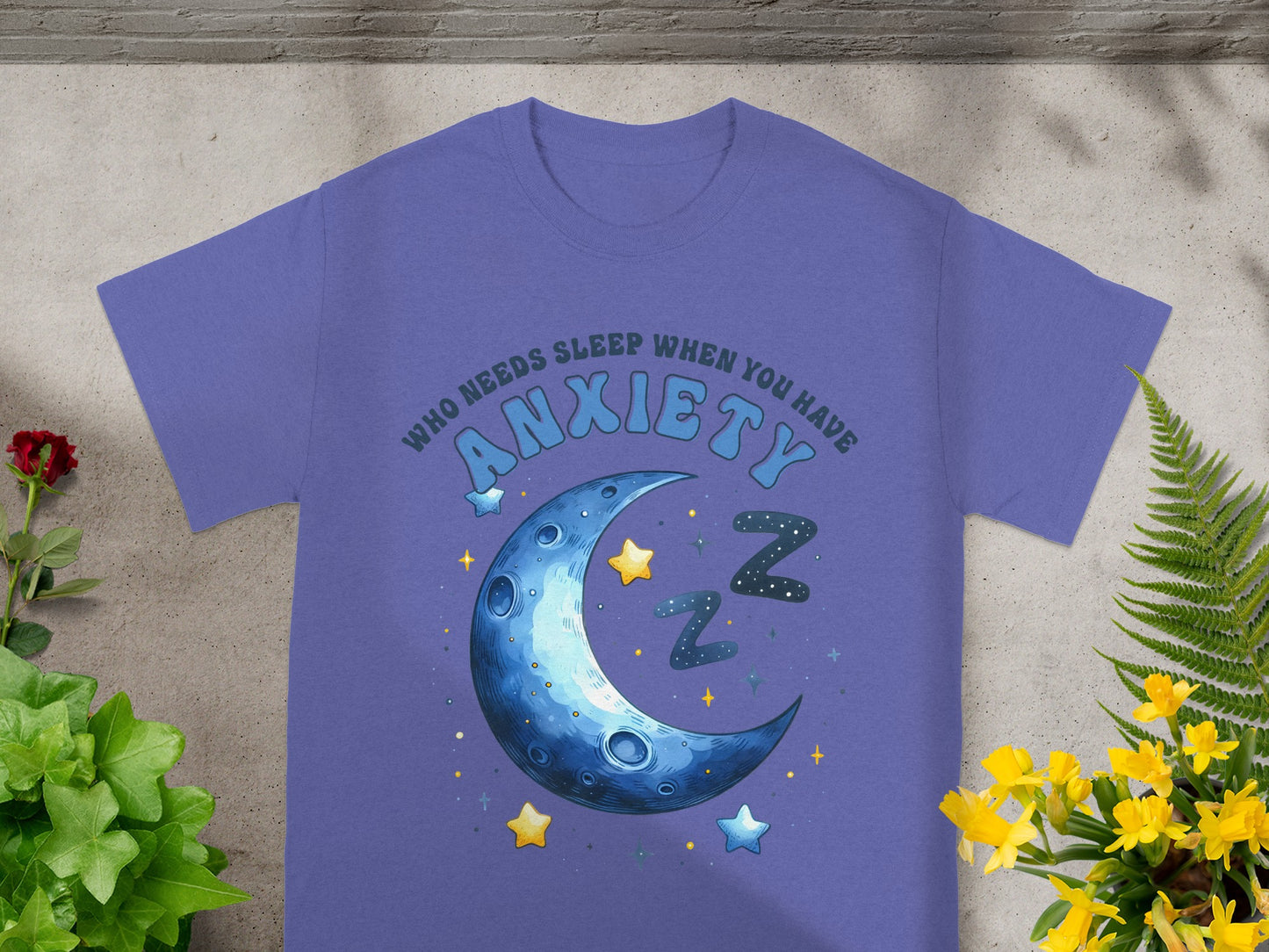 Purple t-shirt with text "WHO NEEDS SLEEP WHEN YOU HAVE ANXIETY" and moon graphic.
