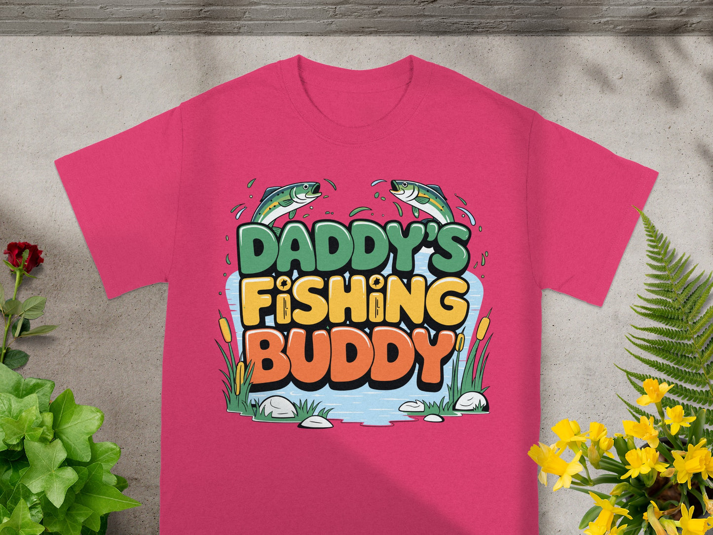 Pink t-shirt with "DADDY'S FISHING BUDDY" text and two fish.