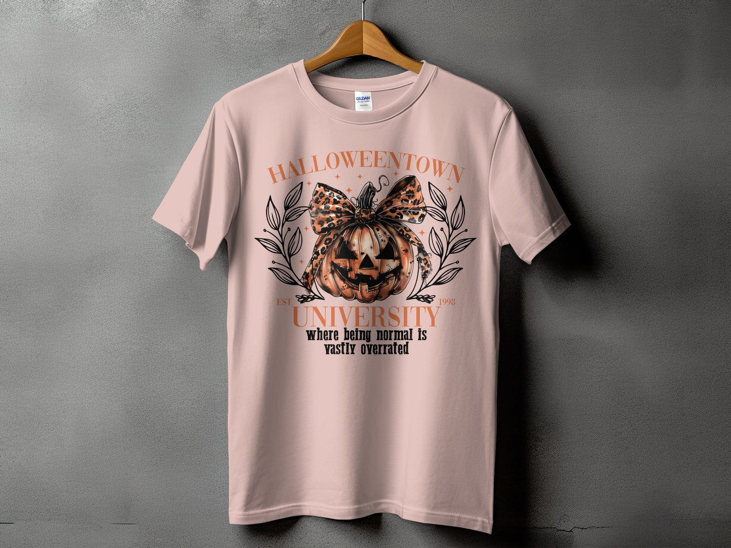 Halloweentown University t-shirt with a jack-o'-lantern, leopard print bow, and text.