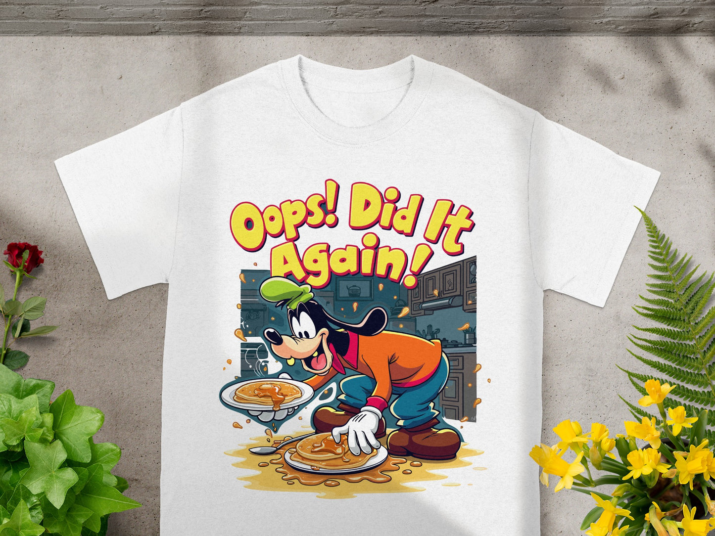 Goofy in cartoon style wearing a chef hat and apron, serving pancakes with text "Oops! Did It Again!"
