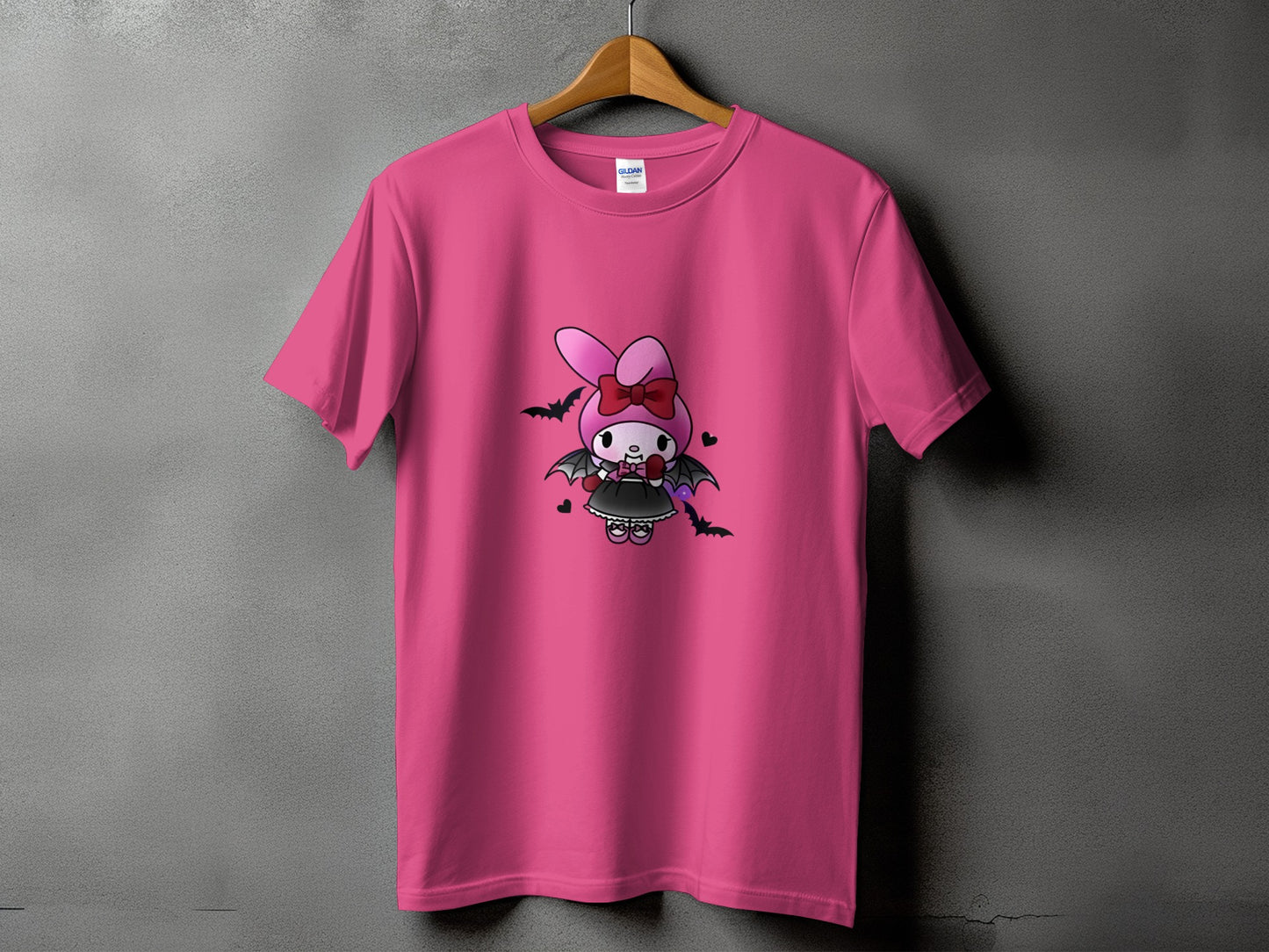 Pink t-shirt with a cartoon bat dressed character with pink bow.