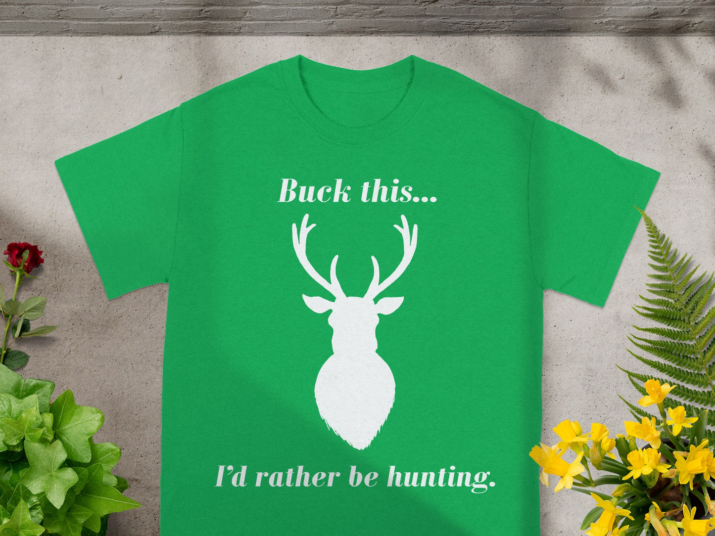 Green t-shirt with white text "Buck this..." and a deer silhouette.