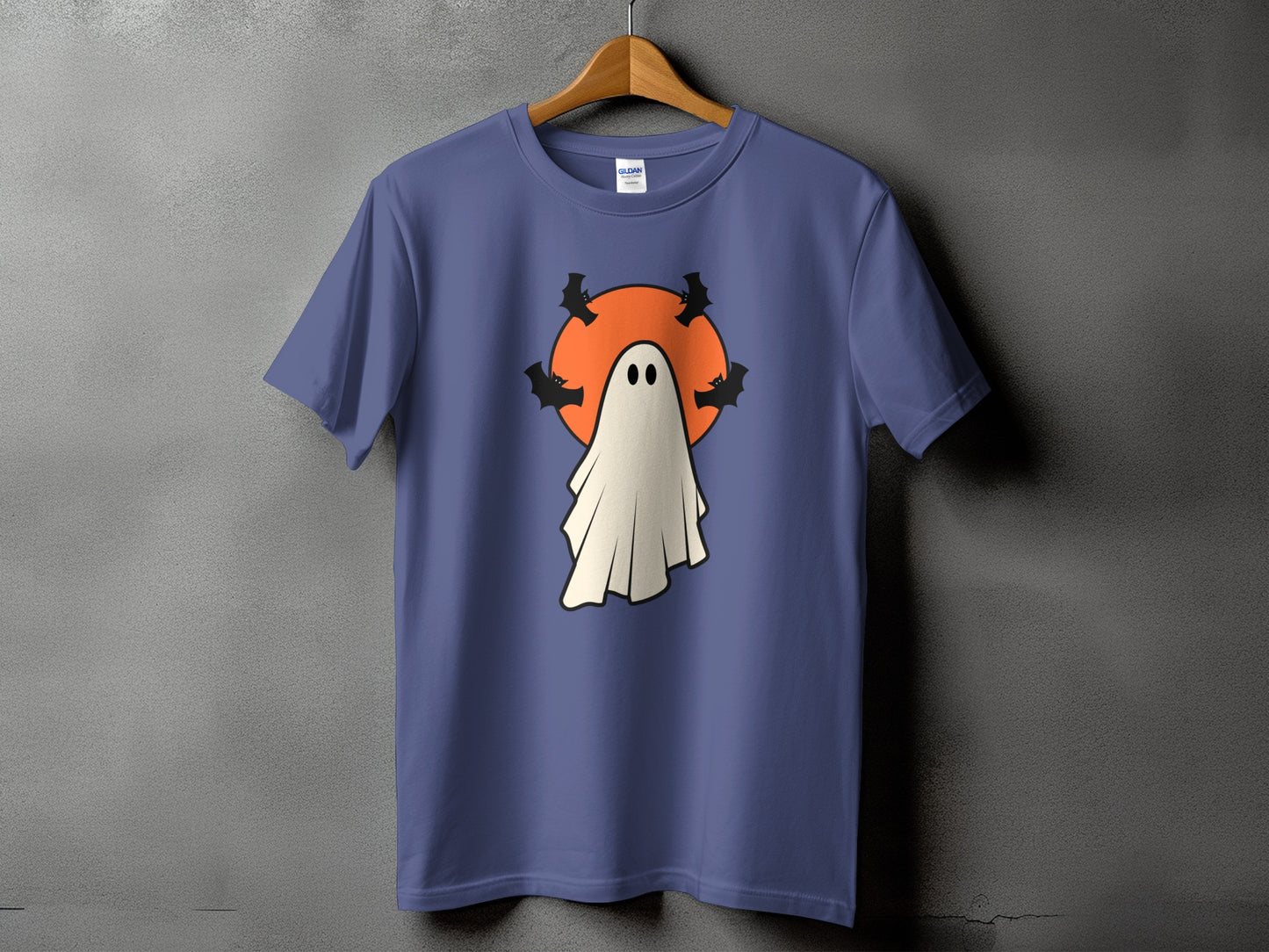 Purple t-shirt with a cartoon ghost and bats in front of an orange circle.