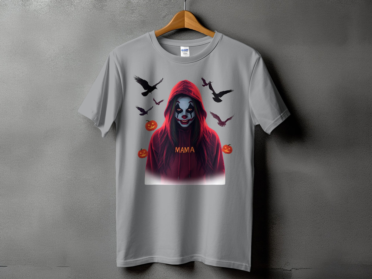 Grey t-shirt with spooky clown design, birds, and pumpkins. "Mama" text.