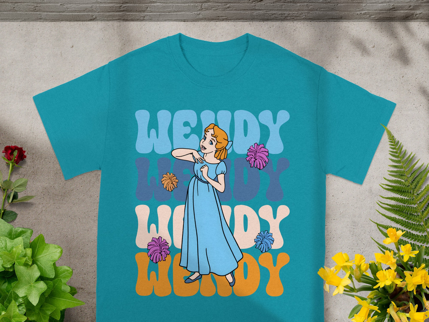 Teal t-shirt with Wendy text and a cartoon girl illustration.