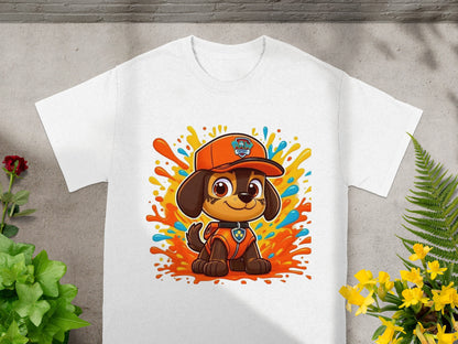 White t-shirt featuring Ryder from Paw Patrol in a colorful splash design.