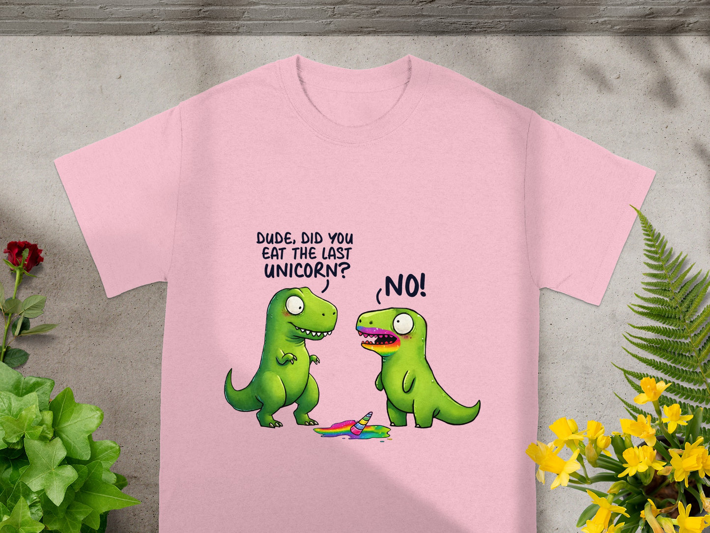 Two cartoon dinosaurs stand near a rainbow puddle with a unicorn horn; text says "DUDE, DID YOU EAT THE LAST UNICORN? NO!".