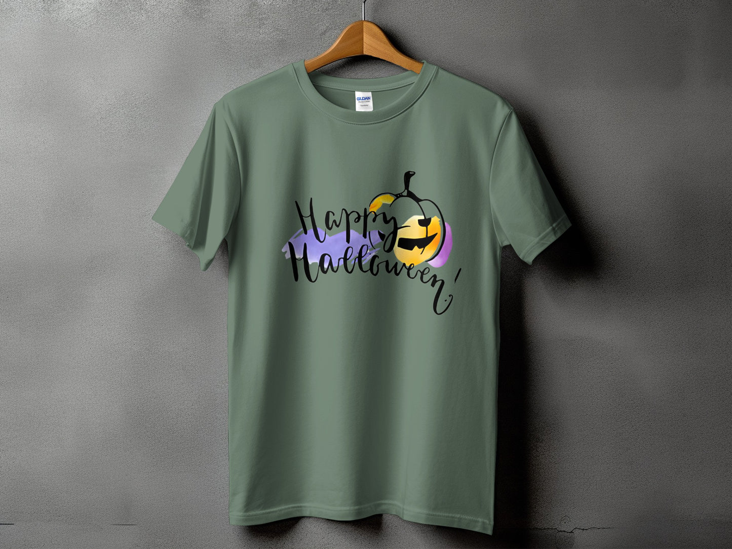 Green t-shirt with "Happy Halloween" text and a watercolor pumpkin graphic.