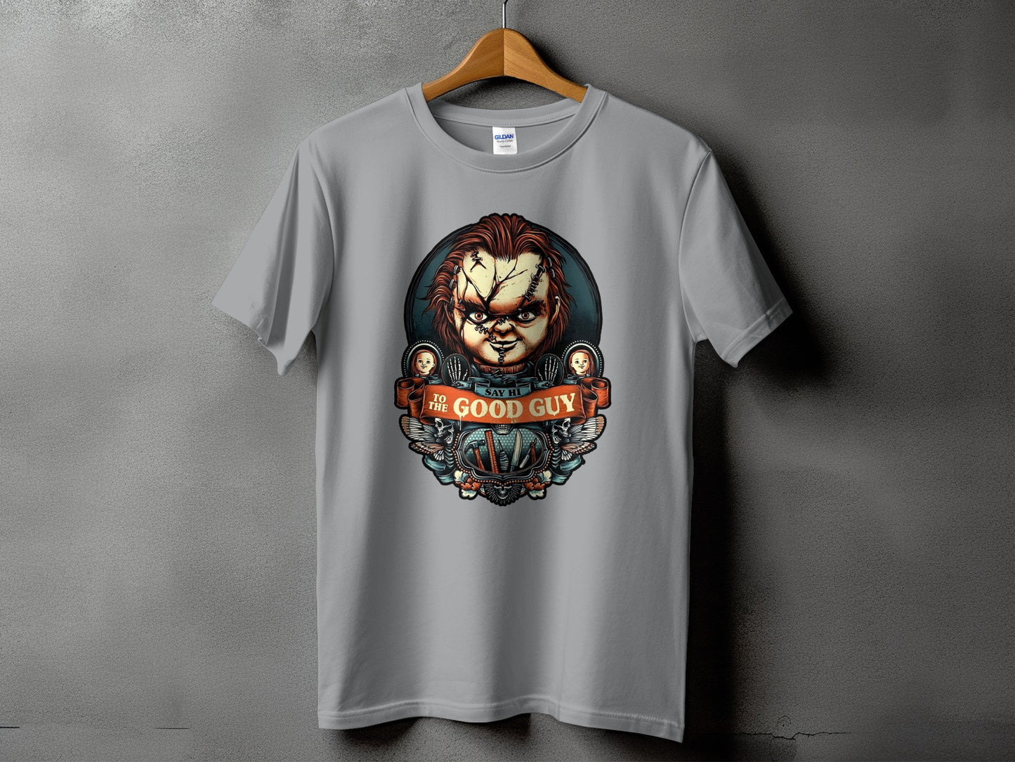 Grey t-shirt with Chucky graphic saying "Say Hi To The Good Guy".