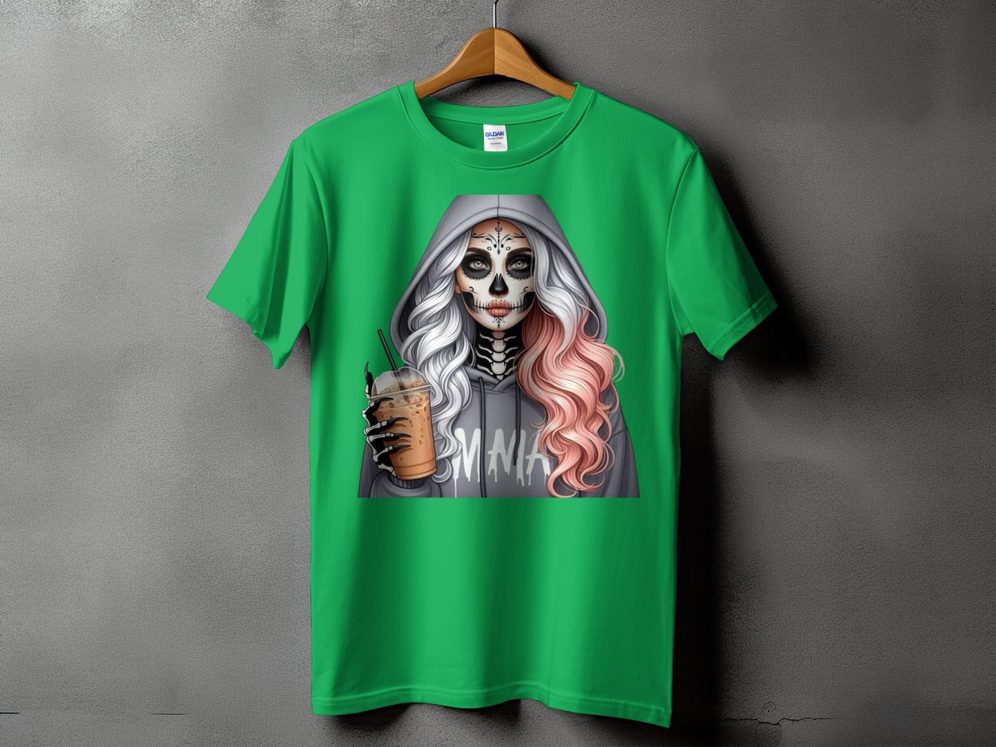 Green t-shirt with graphic of woman in skull makeup holding coffee drink.