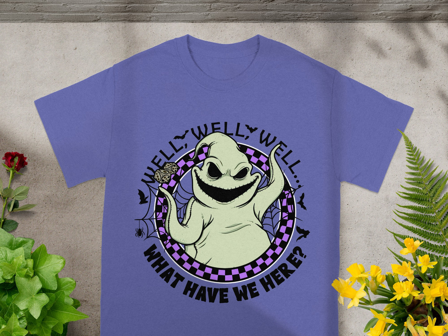 Oogie Boogie character graphic with "Well, well, well... What have we here?" text on purple t-shirt.