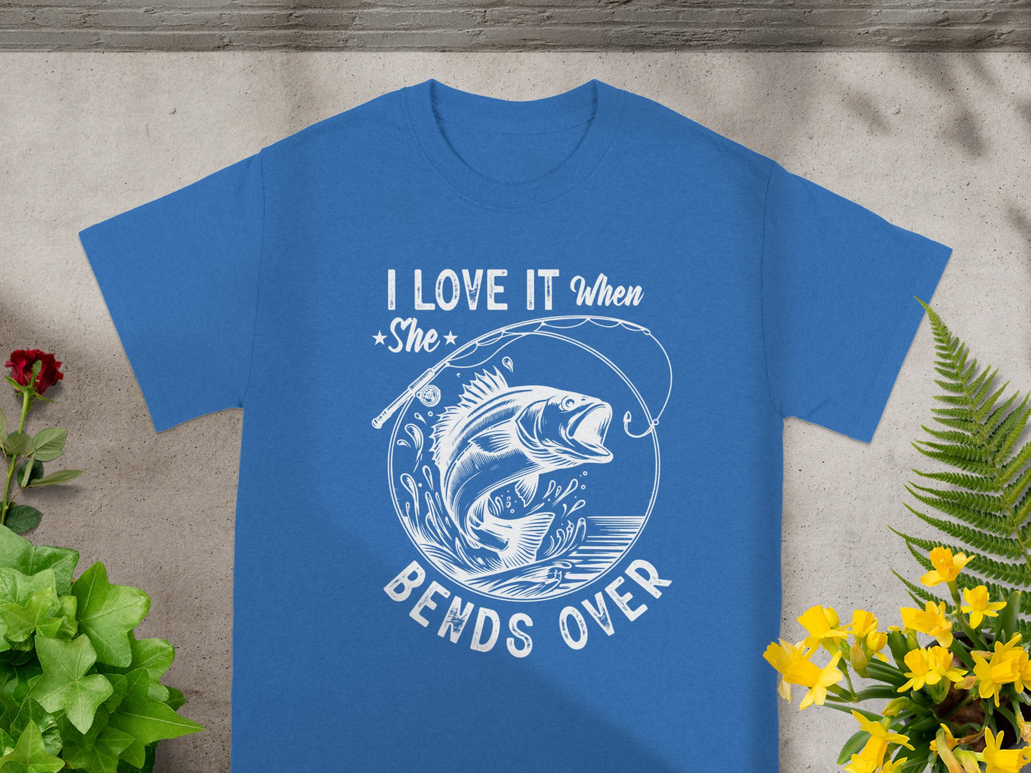 Blue t-shirt with "I LOVE IT when She bends over" and fishing graphic.