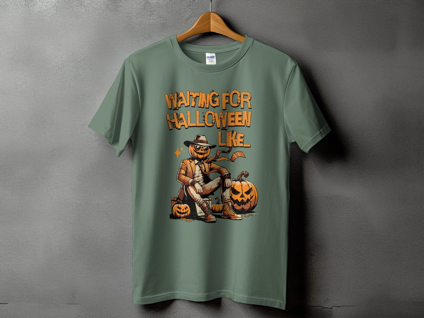 Green t-shirt with graphic reading "Waiting for Halloween Like" and a dapper pumpkin character.