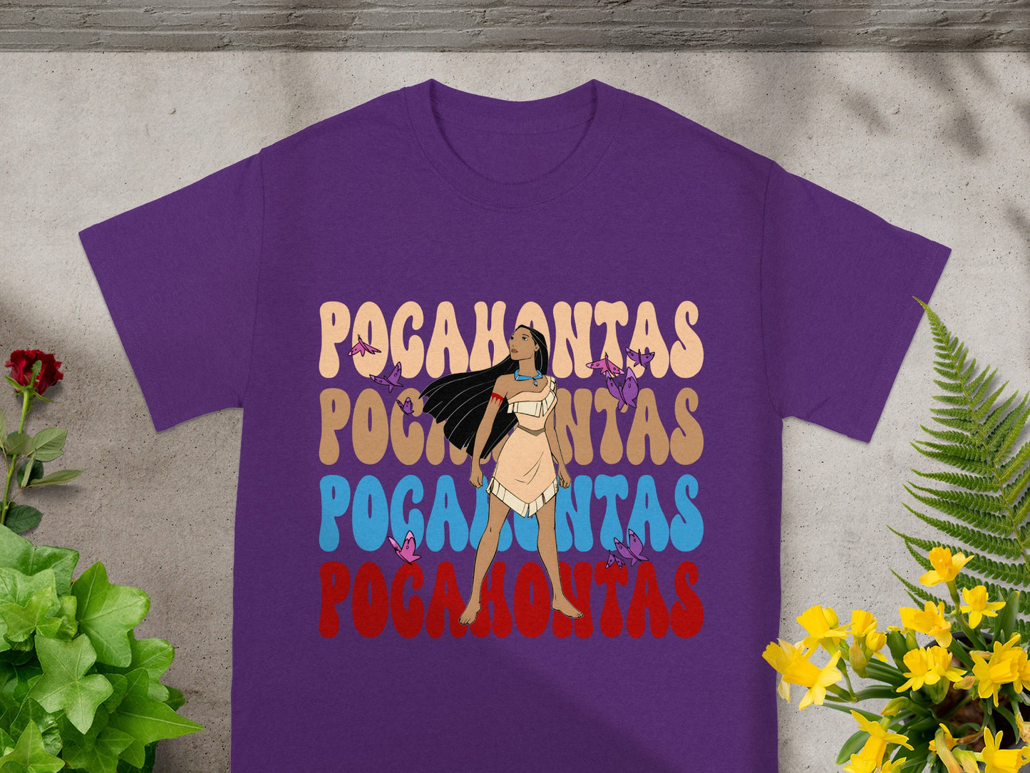 Pocahontas graphic on a purple t-shirt with floral and bird accents.