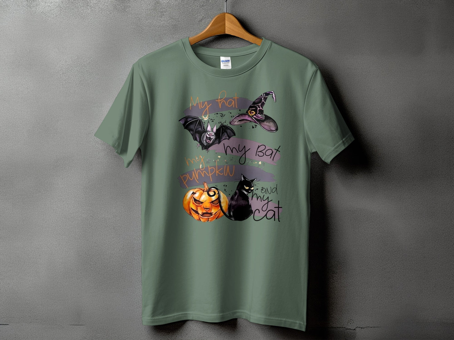 Green t-shirt with "my hat, my bat, my pumpkin, and my cat" Halloween graphic.