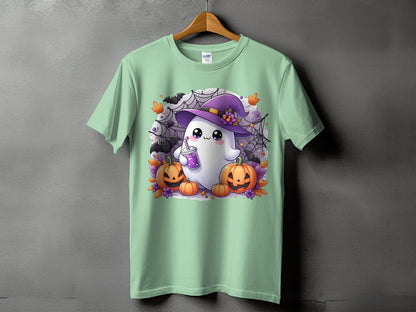 Green t-shirt with cartoon ghost wearing a witch hat and holding a drink.