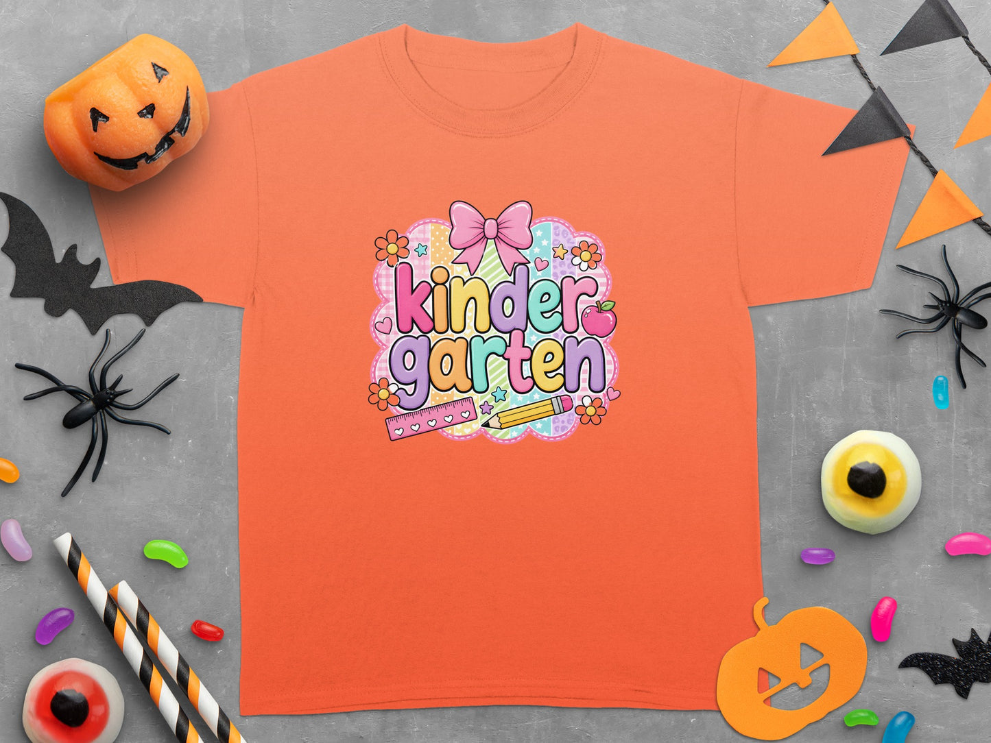 Orange t-shirt with "kinder garten" text and Halloween decorations.