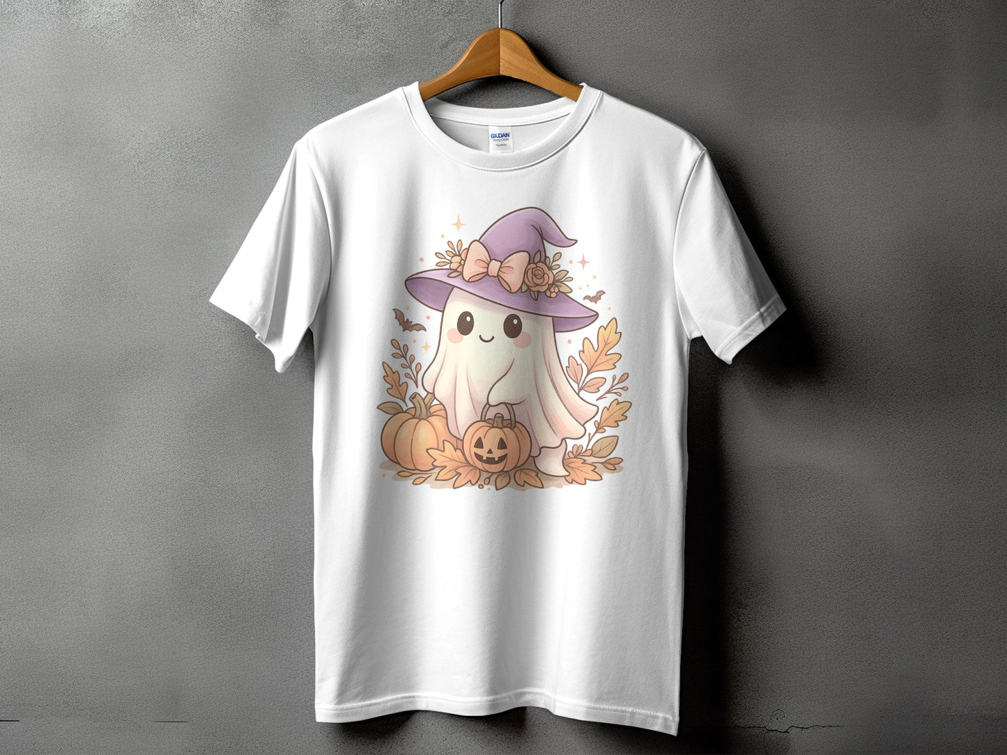 White t-shirt with a cute ghost wearing a witch hat, holding a pumpkin.