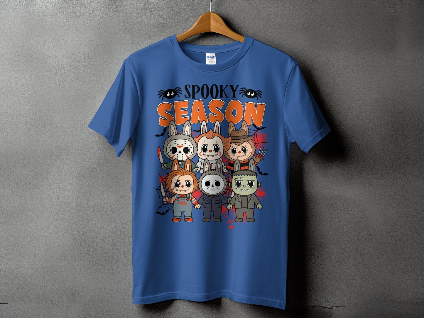 Blue t-shirt with "Spooky Season" and horror characters in a cartoon style.