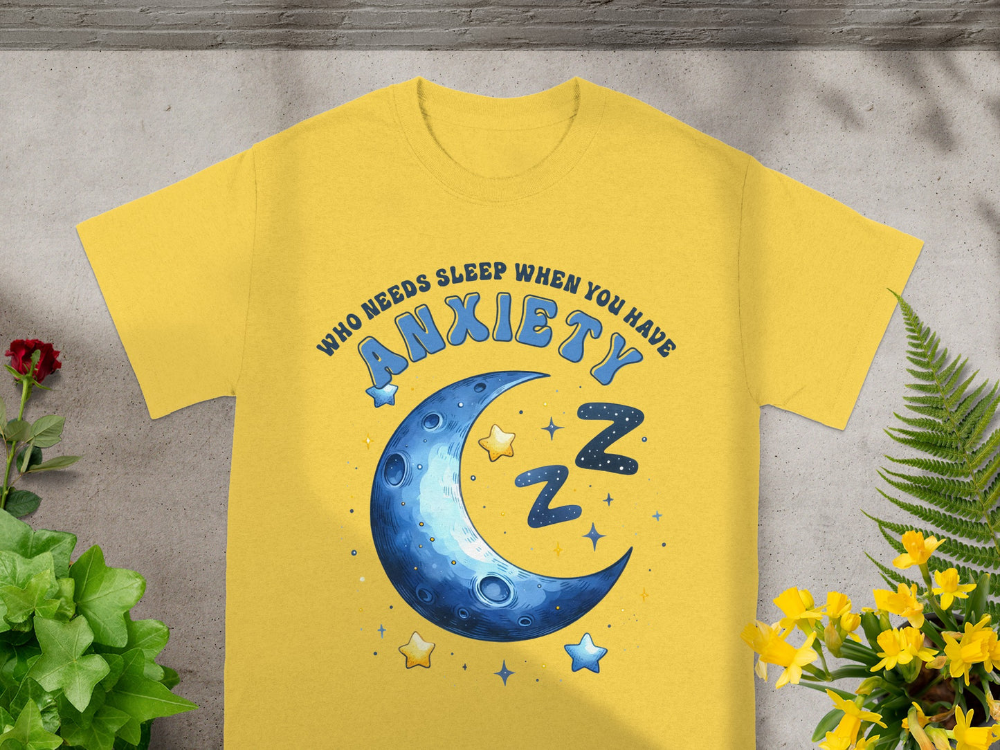 Yellow t-shirt with "Who Needs Sleep When You Have Anxiety" text and moon graphic.