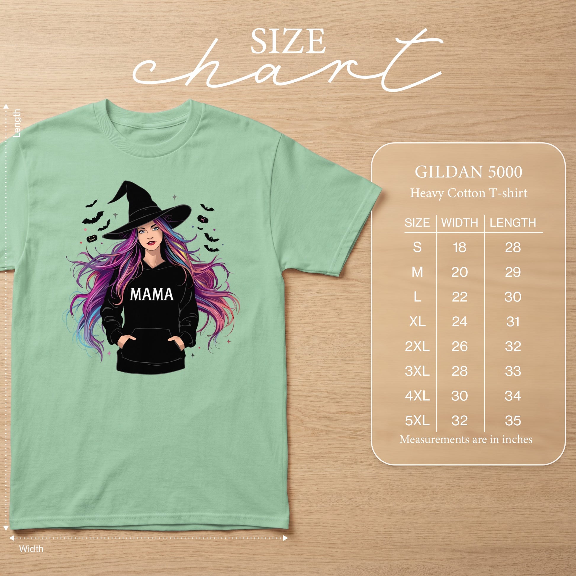 Mint green t-shirt with a witch graphic and a size chart for Gildan 5000 heavy cotton t-shirts.