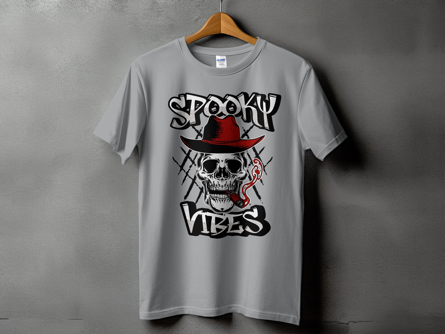 Grey t-shirt with a skull wearing a red hat smoking a cigar, with text "Spooky Vibes".