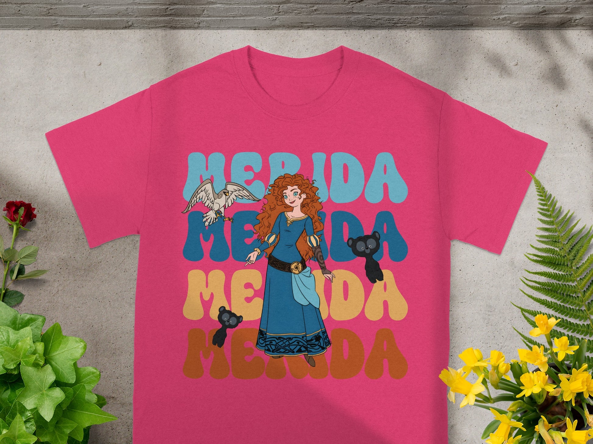 Merida from Brave on a pink t-shirt with "Merida" text in retro font.