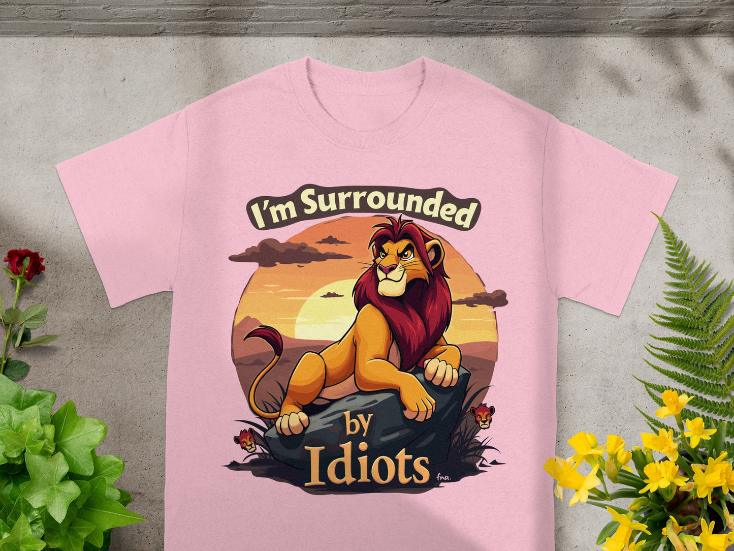 Pink t-shirt with lion and "I'm Surrounded by Idiots" text.