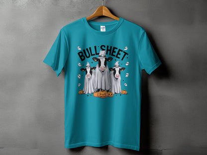 Teal t-shirt with "Bull Sheet" text and three cows in ghost costumes with pumpkins.
