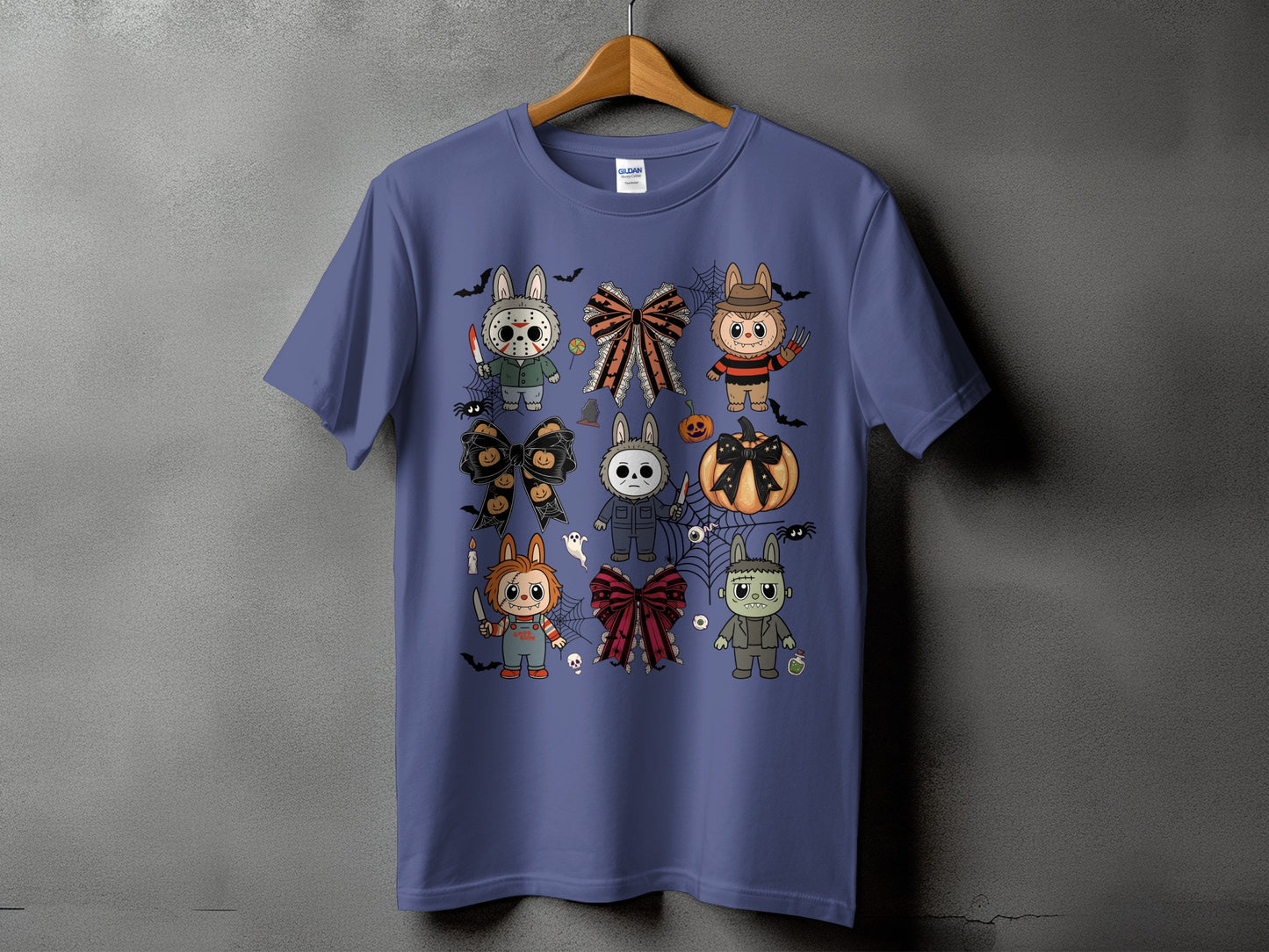 Purple t-shirt with Halloween-themed cartoon characters and bows.