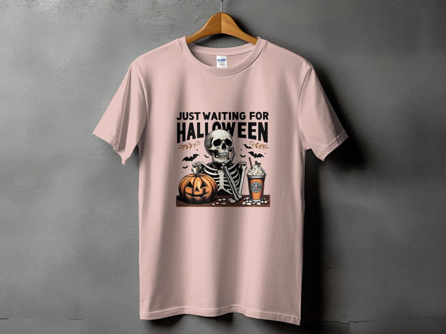 Skeleton, pumpkin, and coffee cup with text "Just Waiting For Halloween".