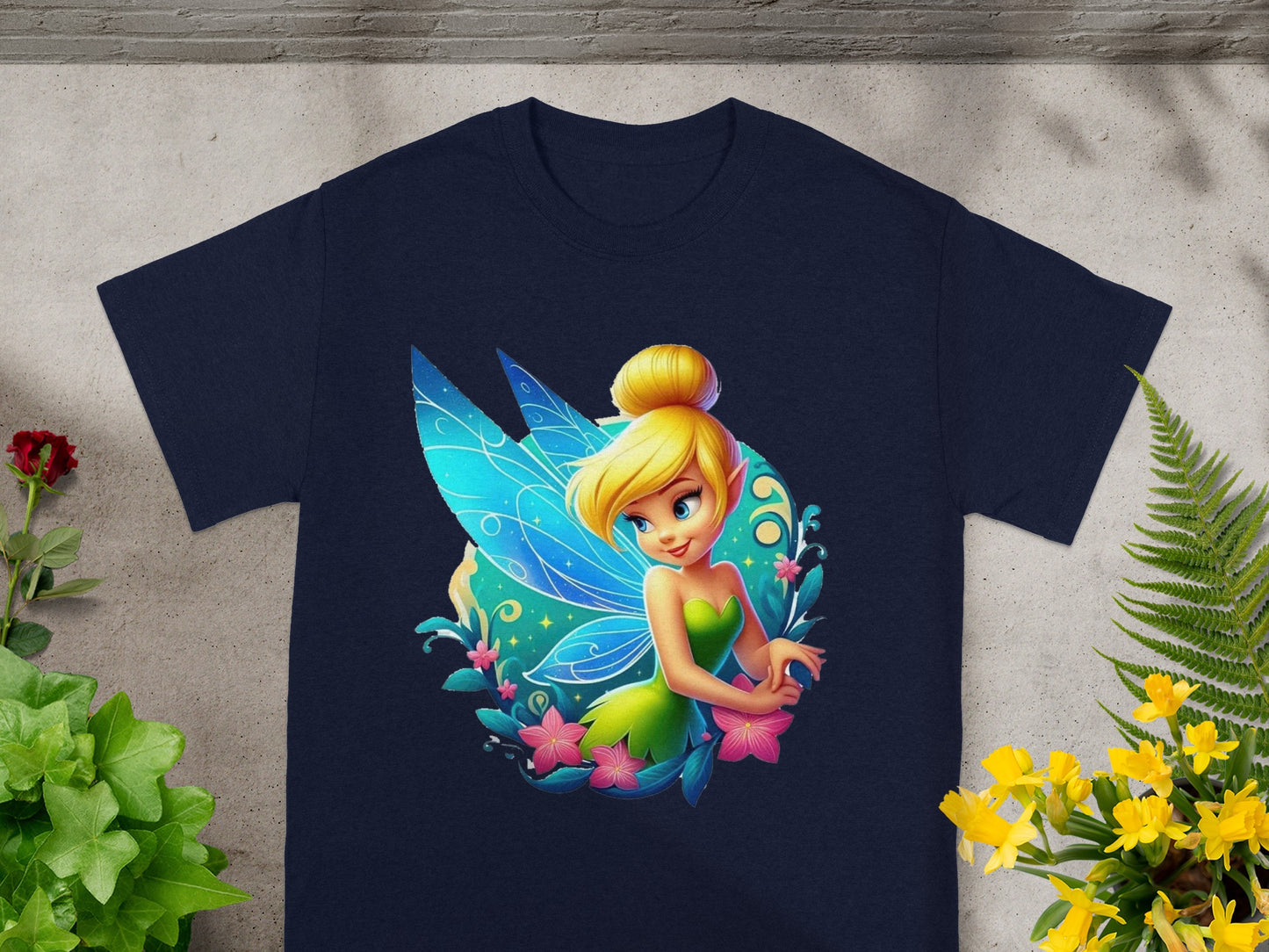 Tinkerbell with blue wings and pink flowers on a navy t-shirt.