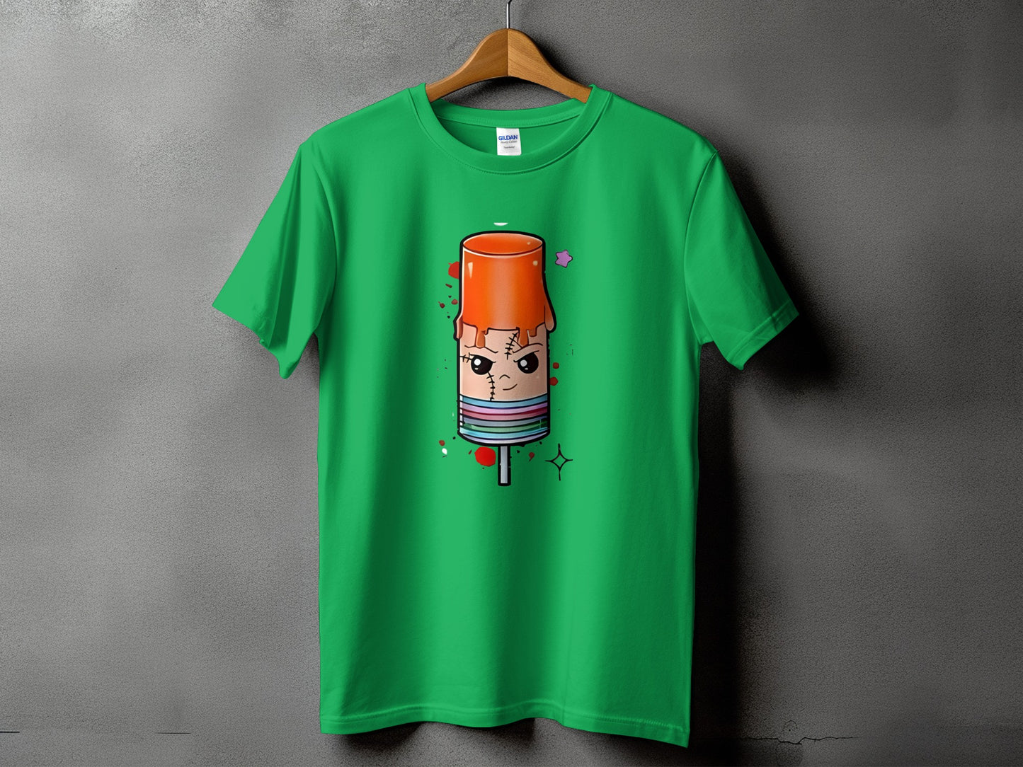 Green t-shirt with cartoon popsicle graphic featuring stitched details and a pink star.