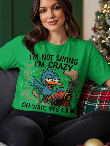 Green t-shirt with cartoon blue bird on a train, text "I'm not saying I'm crazy oh wait, yes I am."