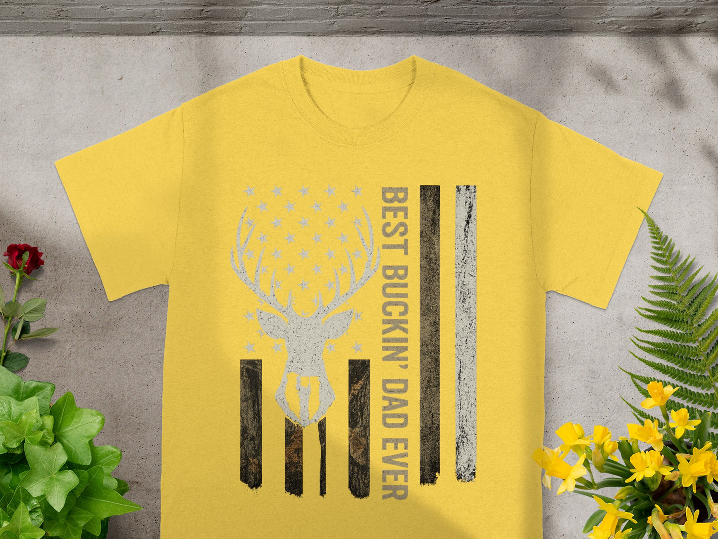 Yellow t-shirt with deer, stars, and "Best Buckin' Dad Ever" text.