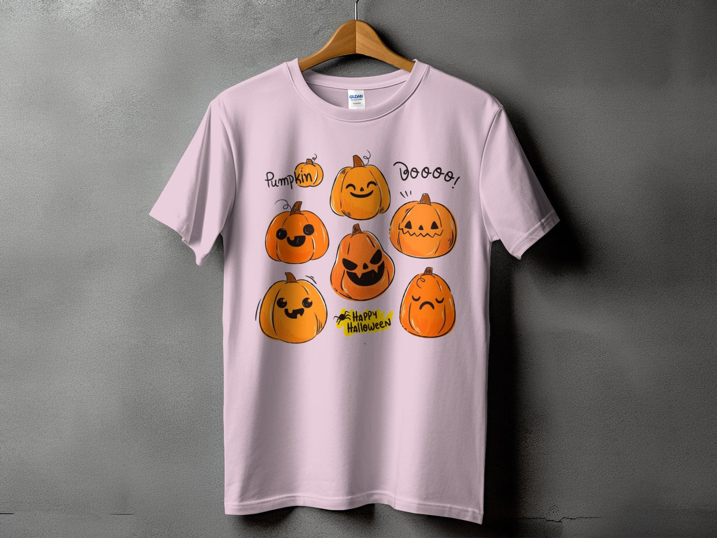 Pink t-shirt with cartoon pumpkins and text: "Pumpkin", "Doooo!", and "Happy Halloween".