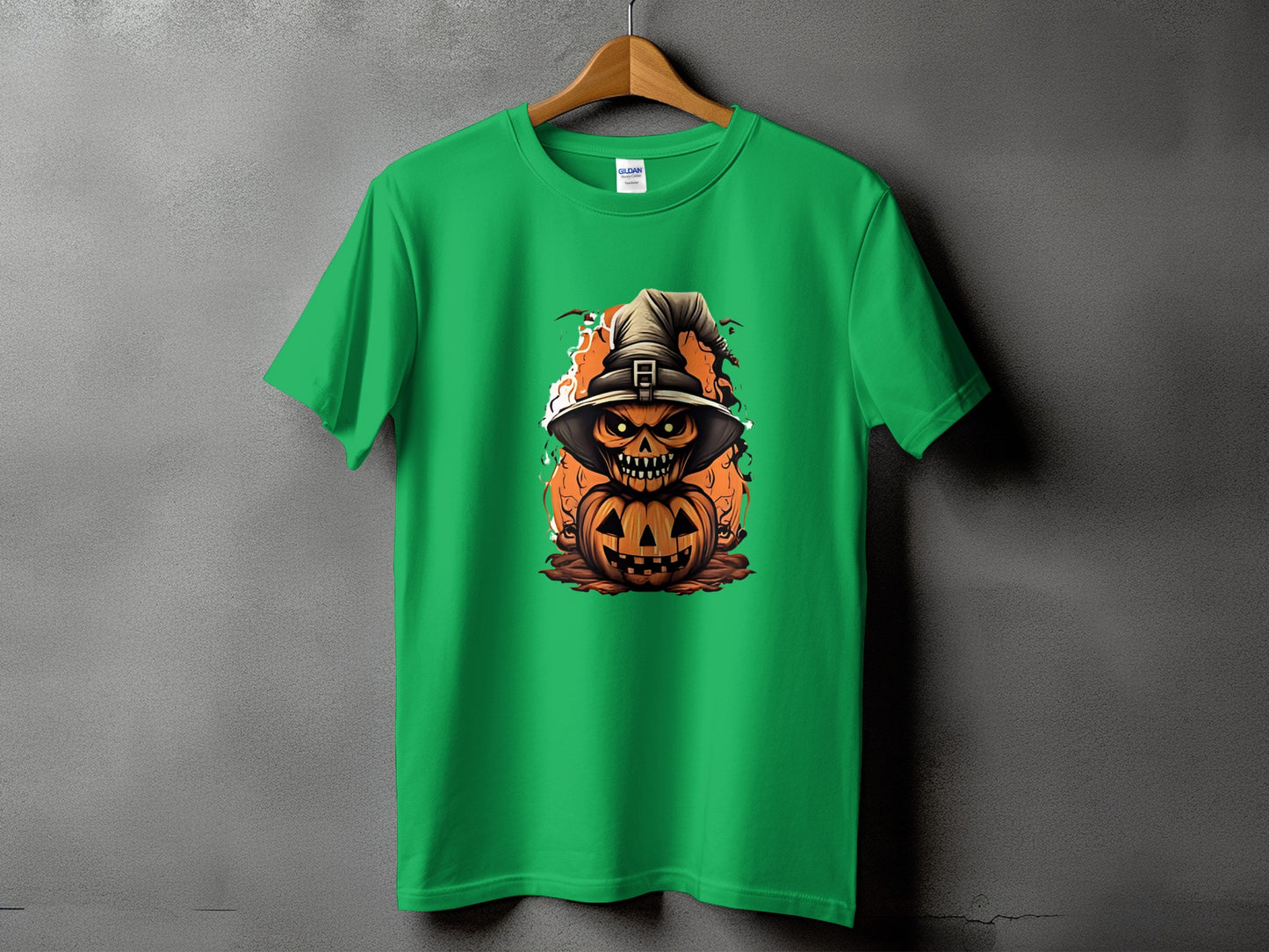 Green t-shirt with a stacked pumpkin and witch hat Halloween graphic.