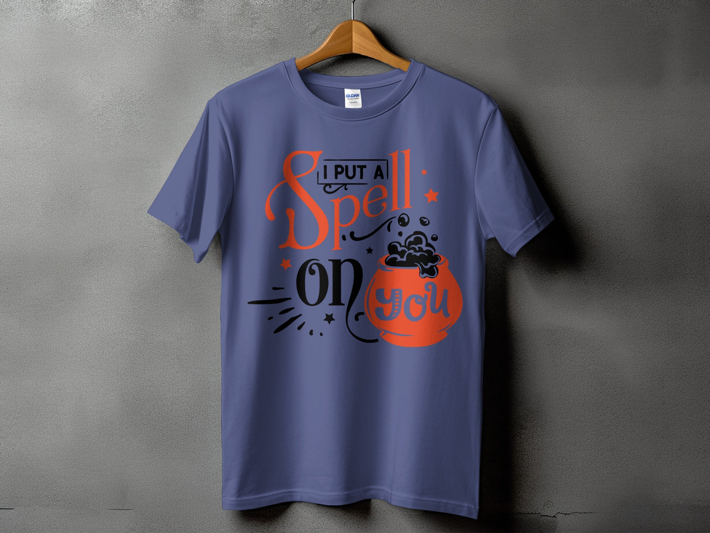 Purple t-shirt with "I PUT A Spell on YOU" Halloween graphic.