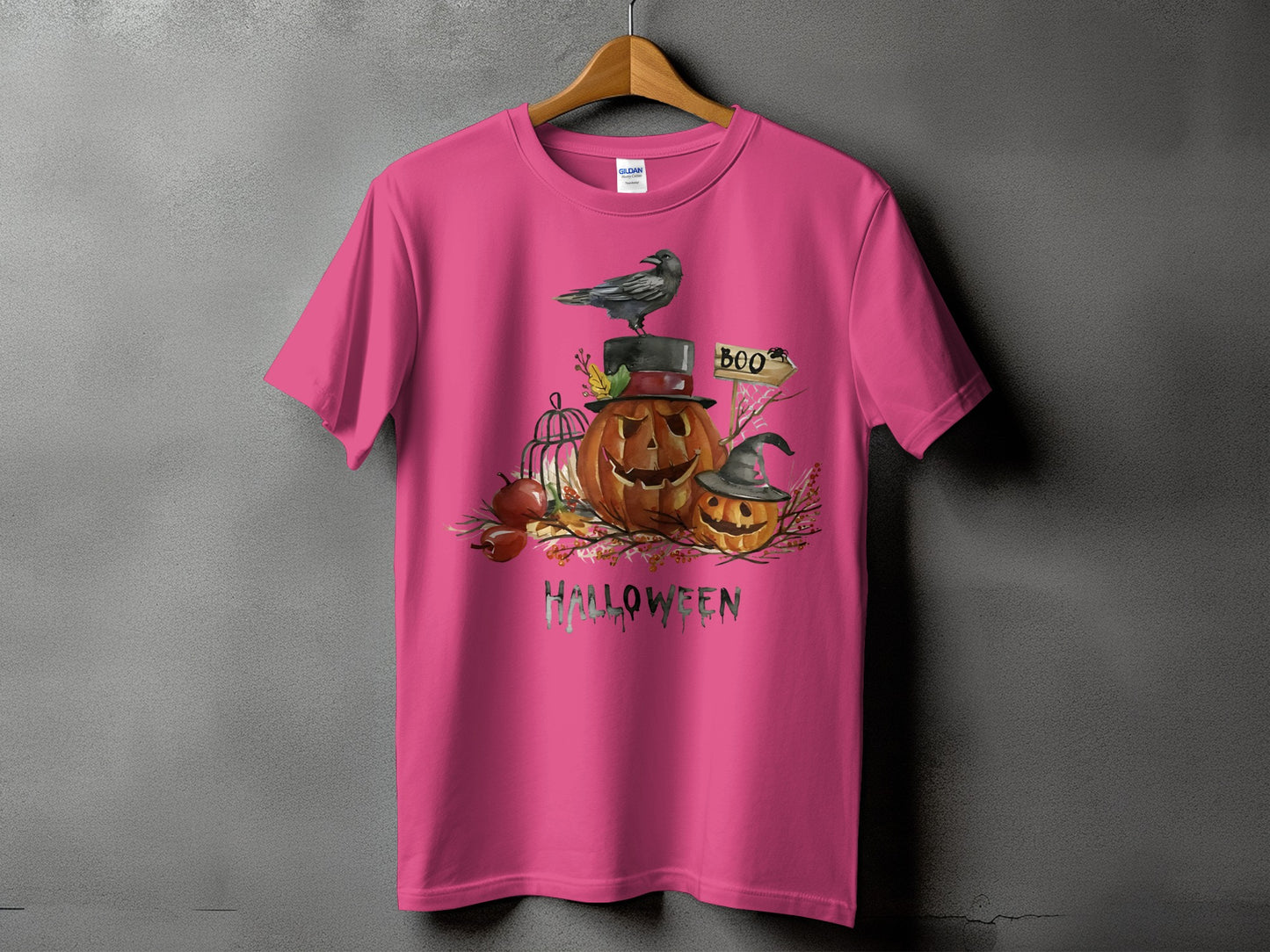 Pink t-shirt with Halloween pumpkins, raven, and "HALLOWEEN" text graphic.