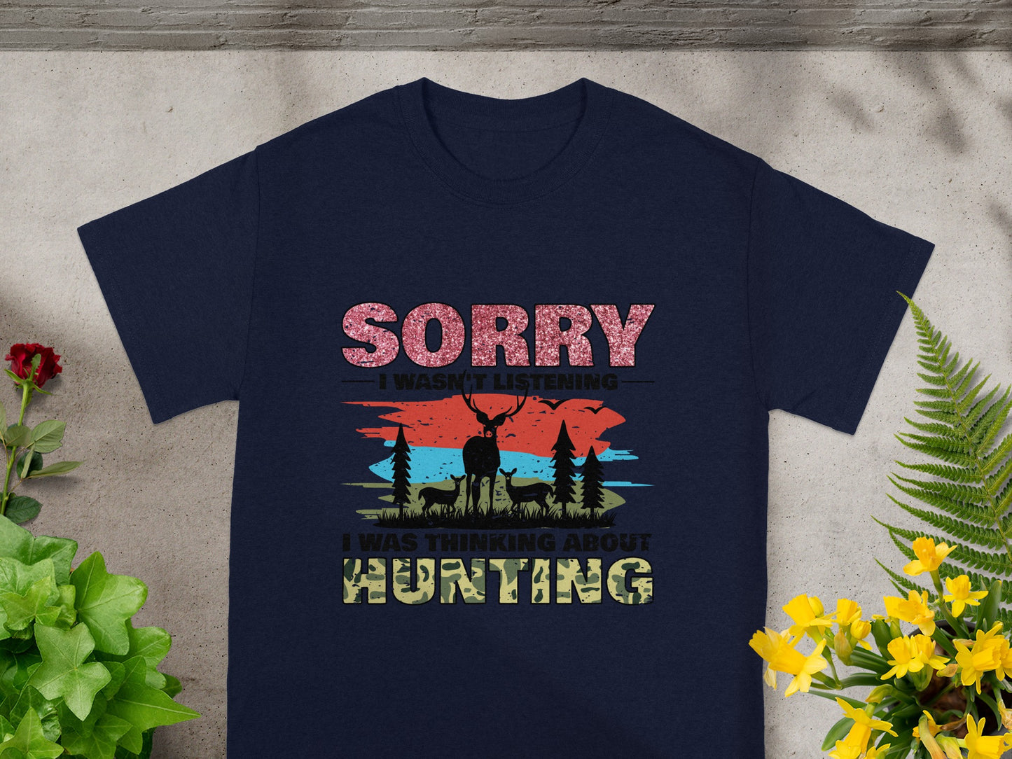 Navy t-shirt with glitter text "Sorry I wasn't listening" and a deer hunting graphic.