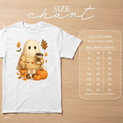 White t-shirt featuring a ghost with a pumpkin bucket, holding coffee, surrounded by autumn leaves. Includes size chart.