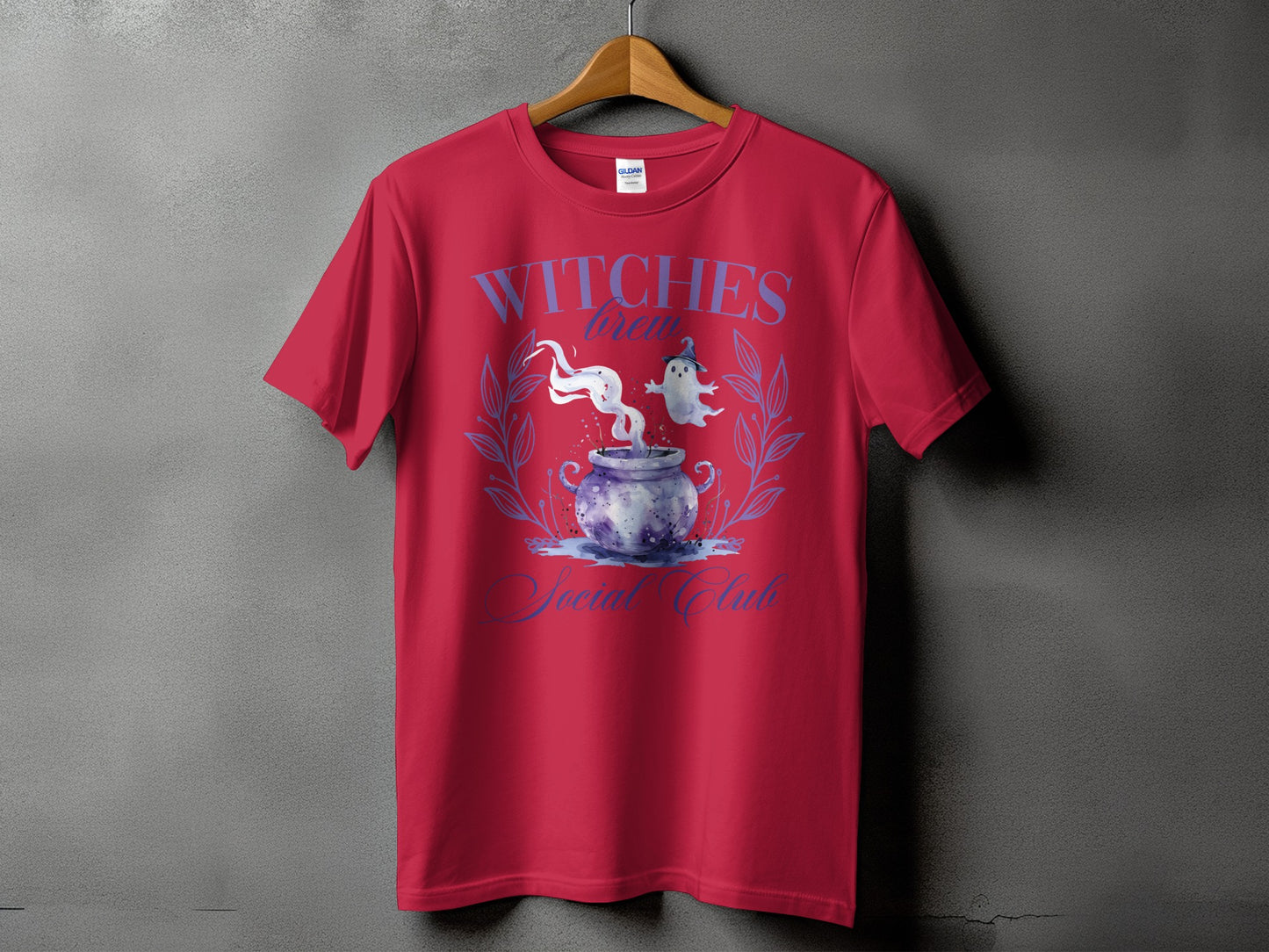 Red t-shirt with "Witches Brew Social Club" text and cauldron design.