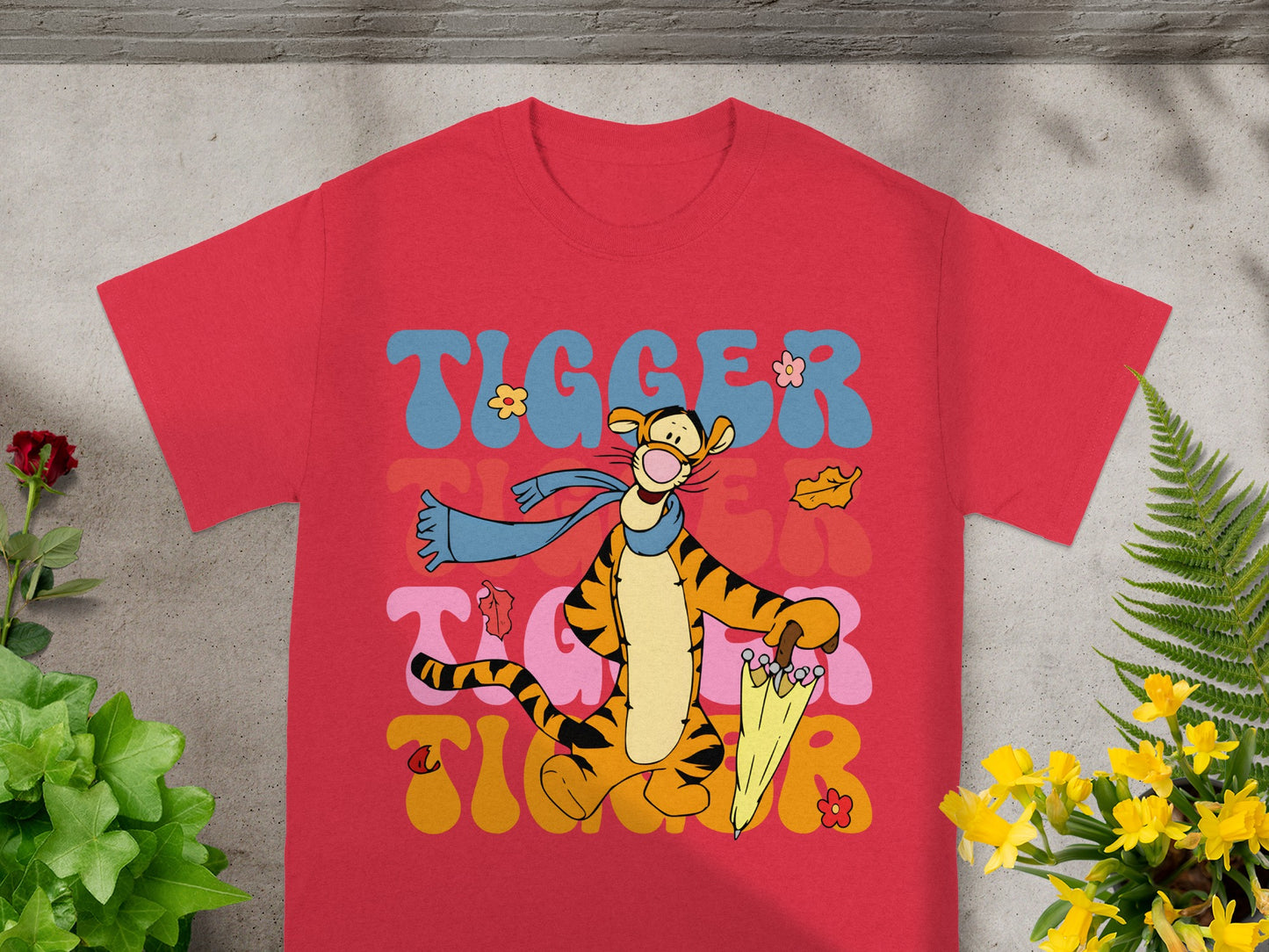 Tigger graphic tee with wavy "TIGGER" text and umbrella.