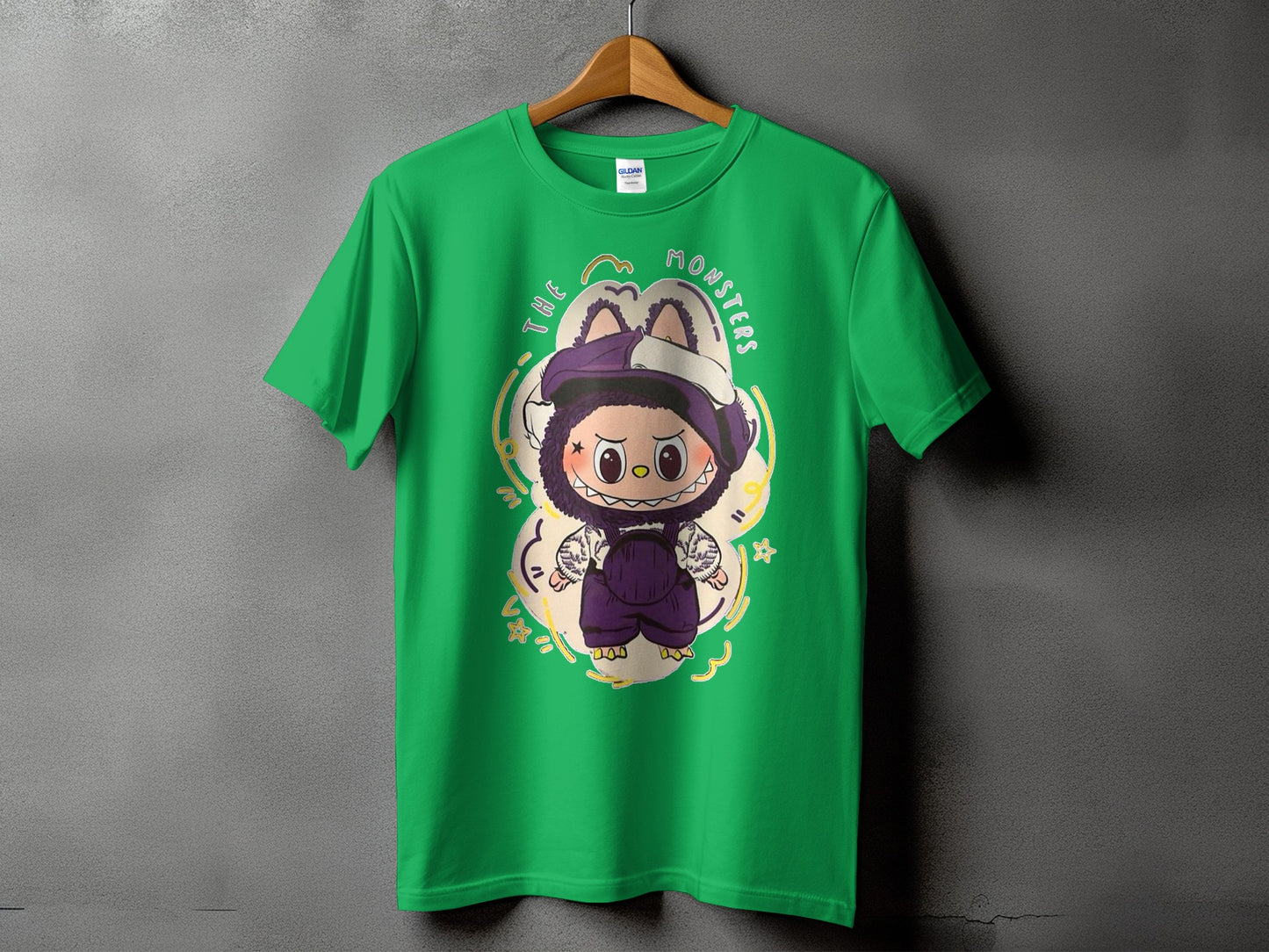 Green t-shirt with "The Monsters" text and a cartoon character graphic.