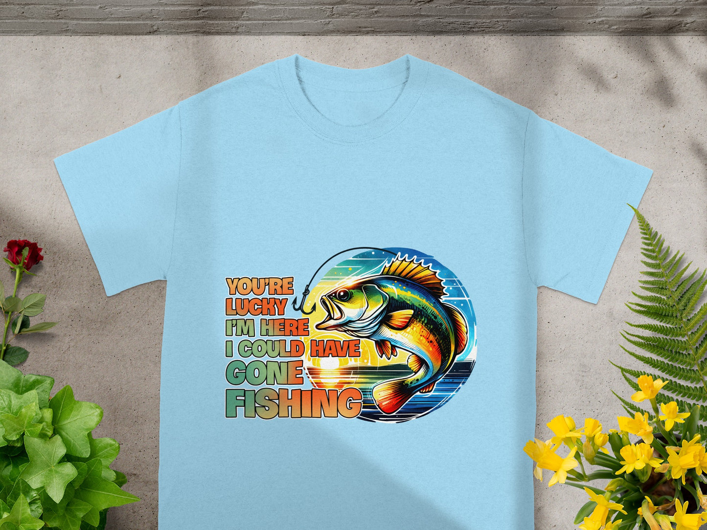 Light blue t-shirt with colorful fish and text: "You're lucky I'm here, I could have gone fishing."