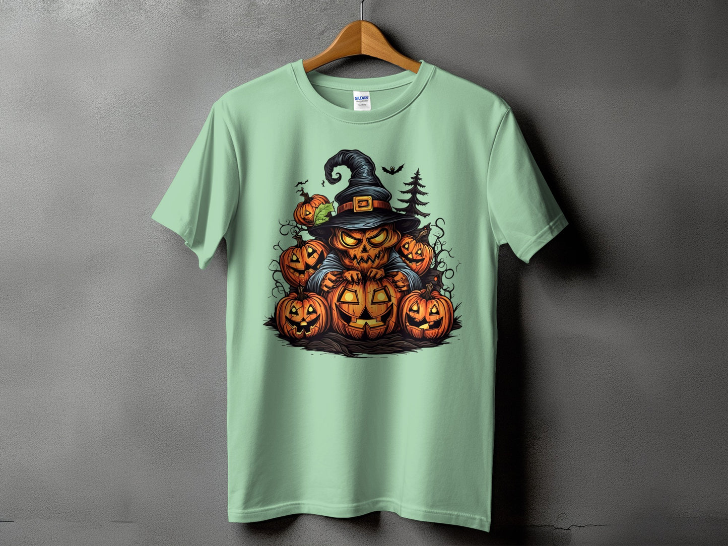 Mint green t-shirt with a Halloween graphic of a jack-o'-lantern surrounded by other pumpkins.