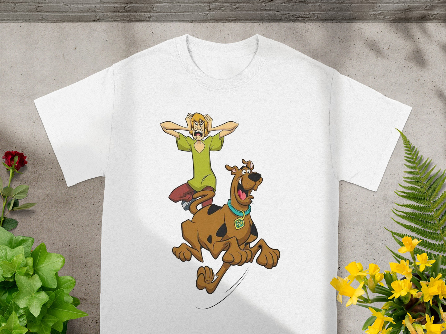 White t-shirt with animated Shaggy and Scooby-Doo jumping.