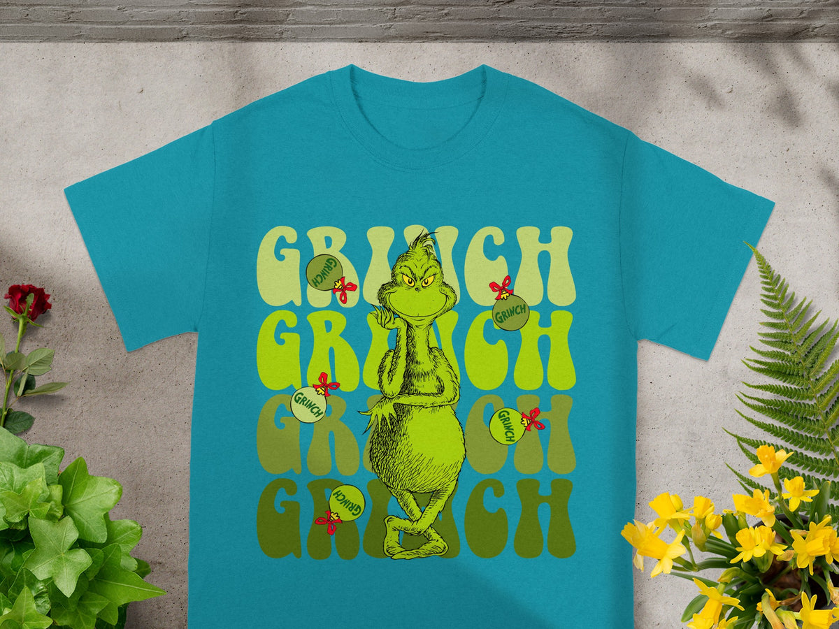 Teal t-shirt with the Grinch character and "GRINCH" text in green.