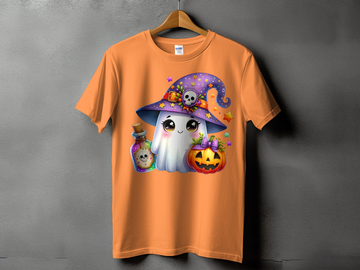 Orange t-shirt with cute ghost, pumpkin, potion bottle, and witch hat Halloween graphic.