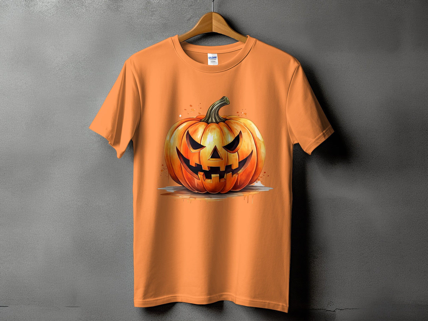 Orange t-shirt with a watercolor jack-o'-lantern design.